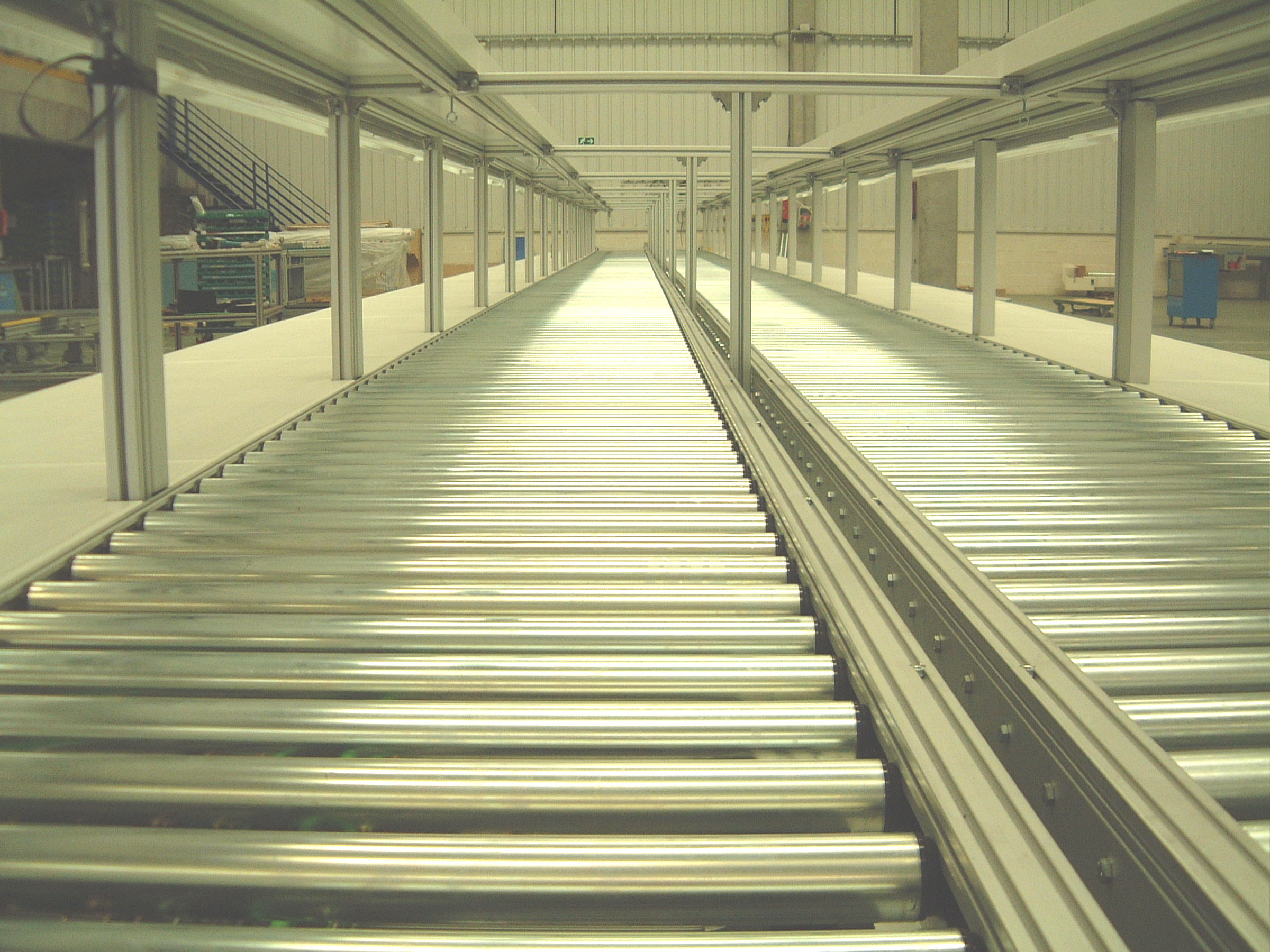 metal rollers from a conveyor